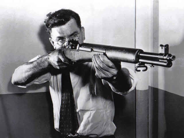 John Cantius Garand with his M1 rifle