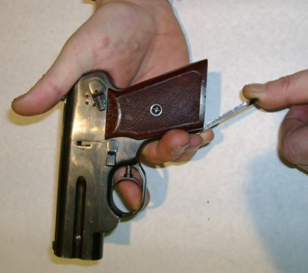 S4M pistol, cocking the internal hammers by pulling down the cocking lever