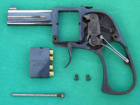 Bar pistol with lockwork exposed 