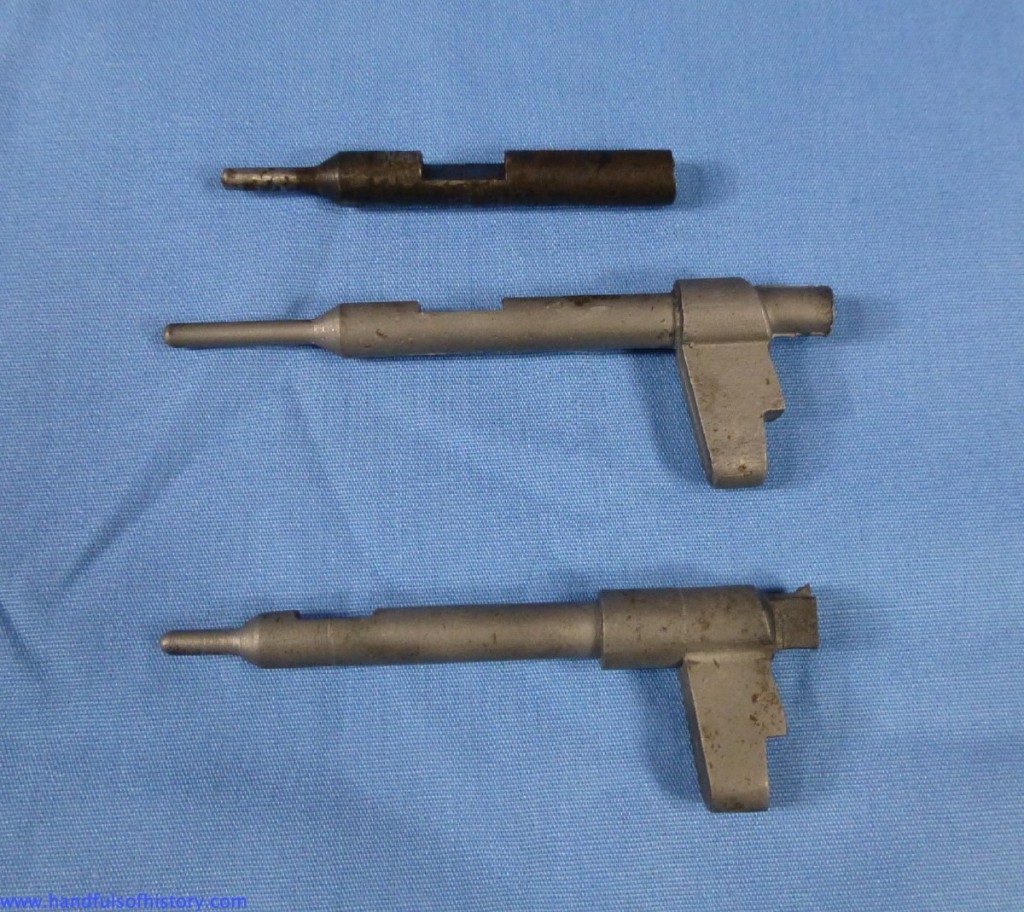 The remnants of the original firing pin above two replacements obtained from the Rifle Shop.  The original is a better match to the “old style” pin.