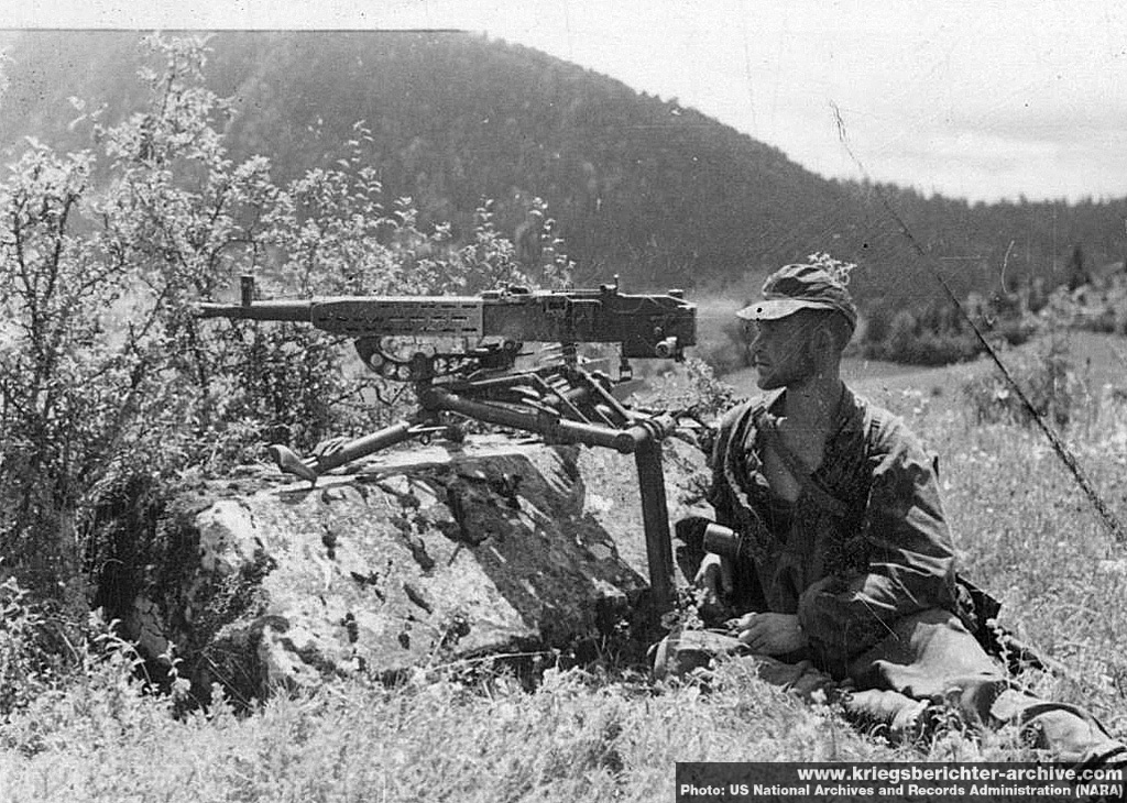 Waffen-SS soldier manning a Czech ZB-37 machine gun on its tripod