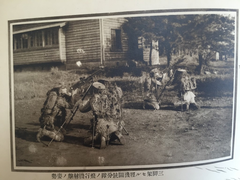 More antiaircraft practice with Type 11 Nambu machine guns - note the camo netting over the soldiers' packs