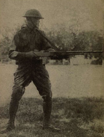 A US soldier demonstrates walking fire with a BAR