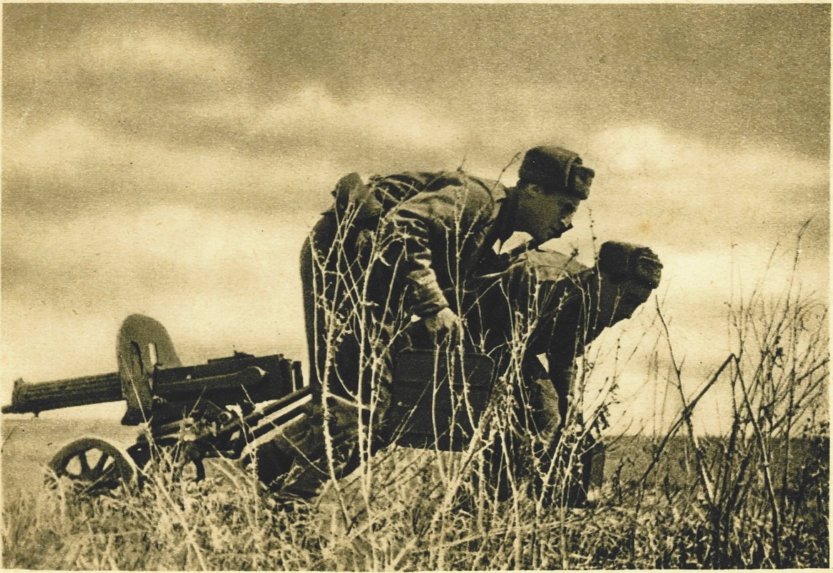 Soldiers pulling a Russian 1910 Maxim into position on a wheeled Sokolov mount