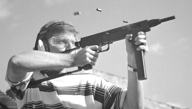 The author's son firing an experimental short-barreled 9mm INA 953