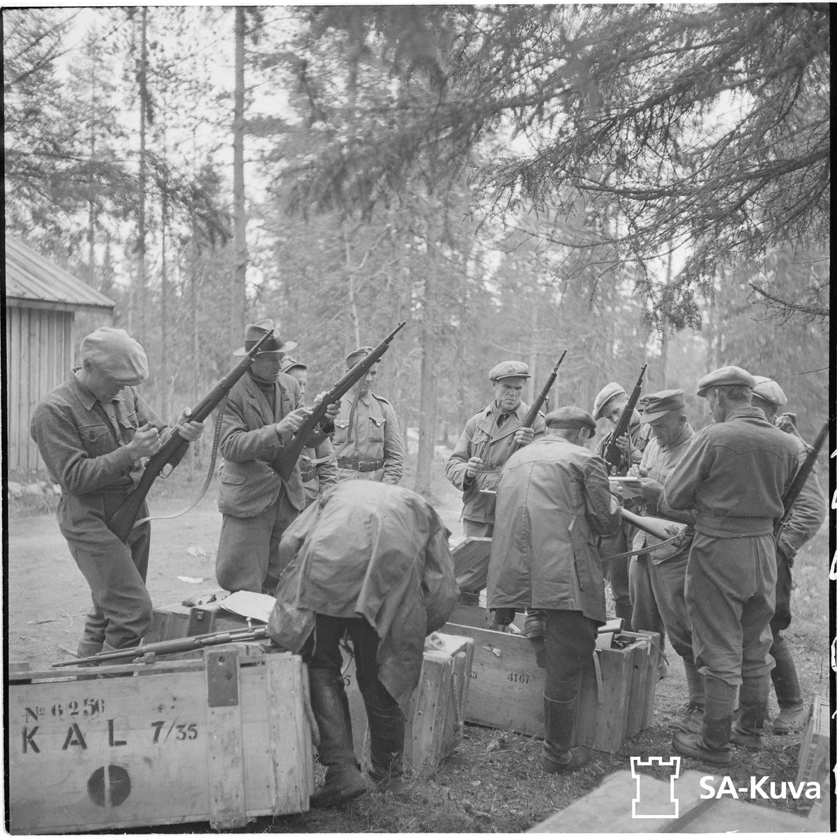 Finnish militiamen being issued 7.35mm Carcano rifles