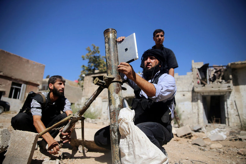 Syrian rebel using an iPad to measure mortar angle