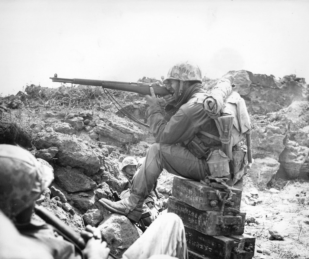 American marine aiming an M1 Garand on Iwo Jima