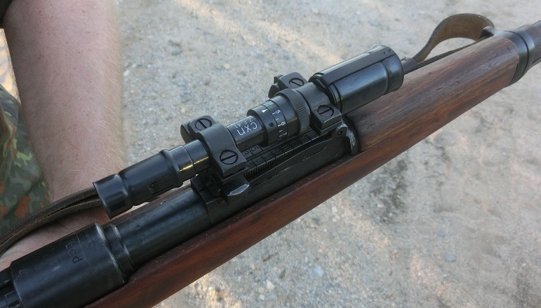 It is a long eye relief design, mounting over the rear sight of a K98k