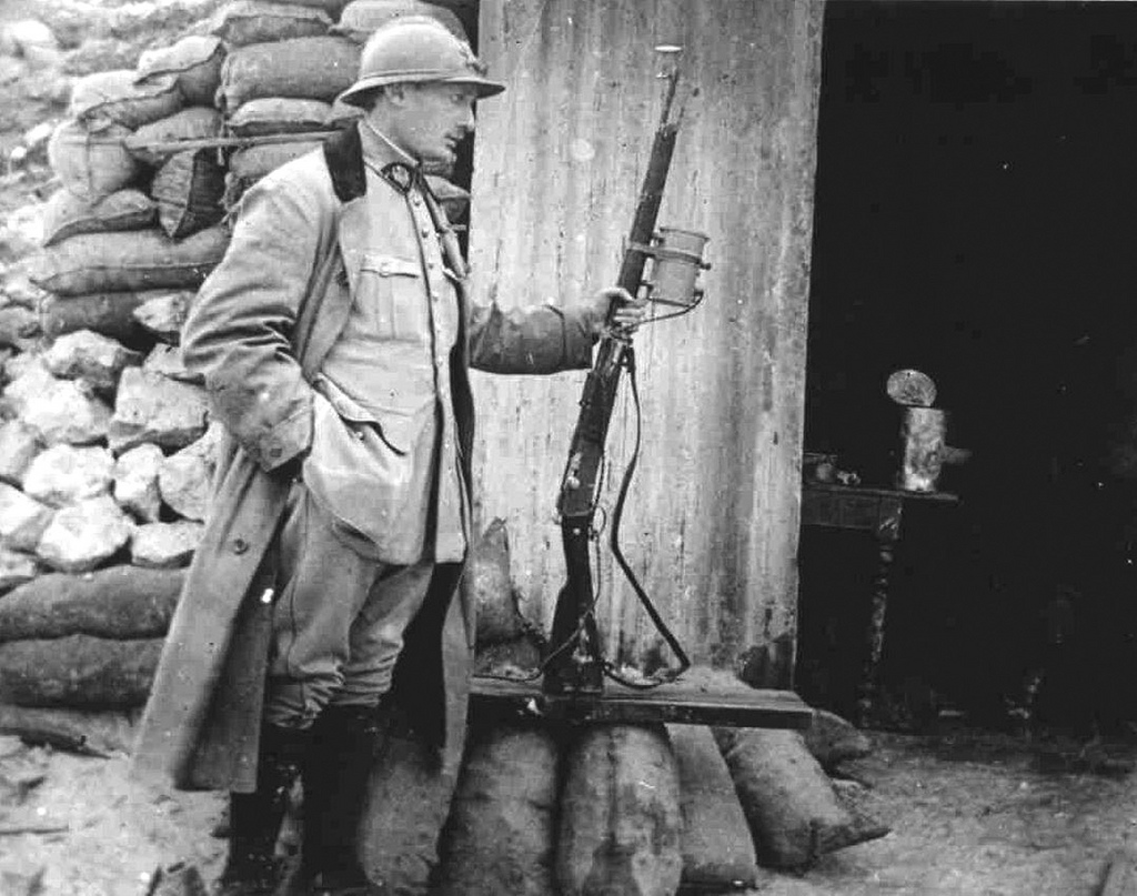 French officer with a Lebel rifle with mounted light