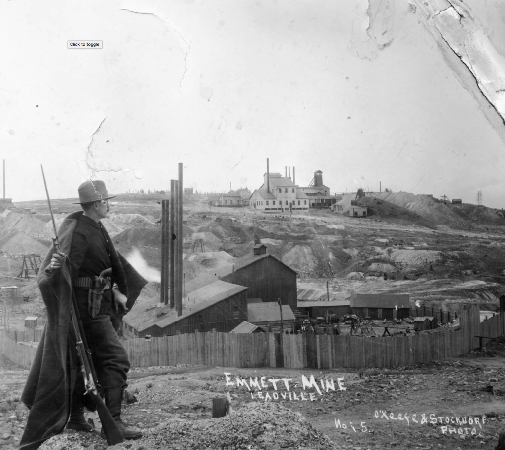 Man standing watch at the Emmett Mine in Leadville Colorado during labor disputes