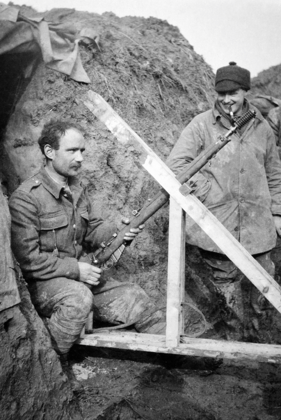 2nd Lieutenant L. J. Barley of the 1st Battalion, Cameronians (Scottish Rifles), watching as a rifle grenade is prepared for firing from trenches at Grande Flamengrie Farm on the Bois Grenier sector of the line during February 1915.