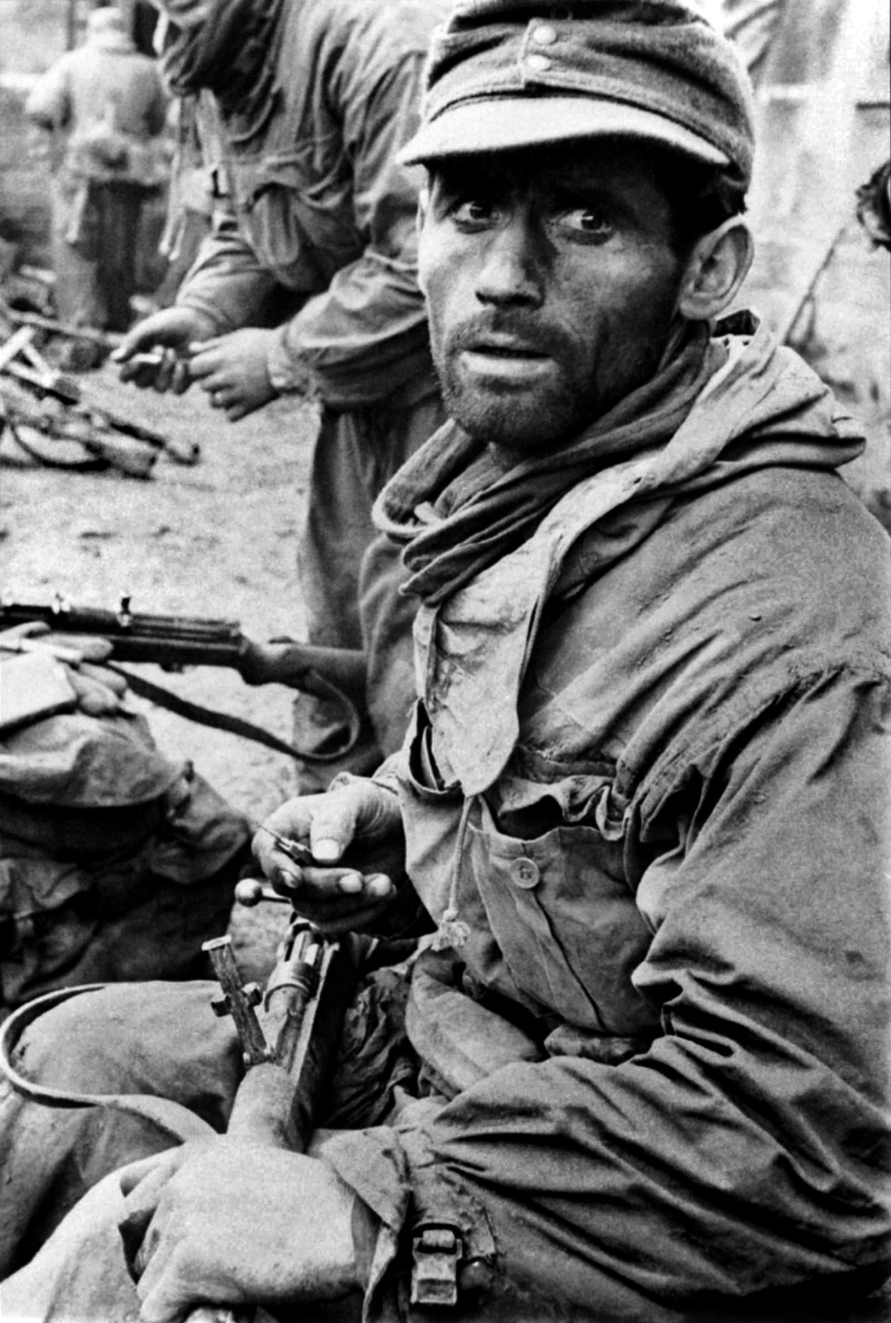 German soldier cleaning his rifle