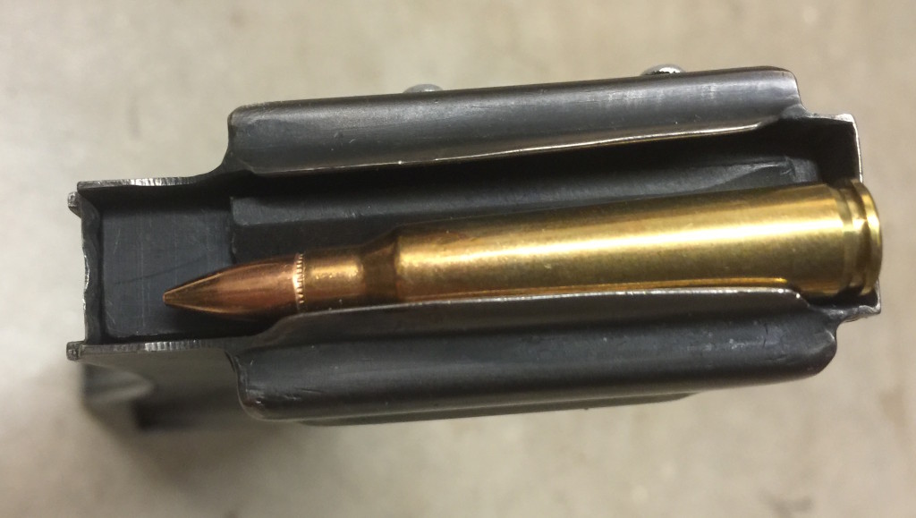 XM-19 magazine with a 5.56mm NATO cartridge for scale reference